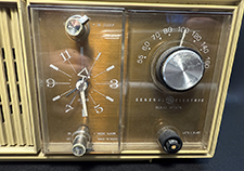 Clock face and radio tuner.