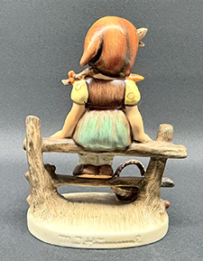 Back view of figurine.