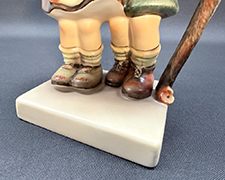 Close up of base of figurine.